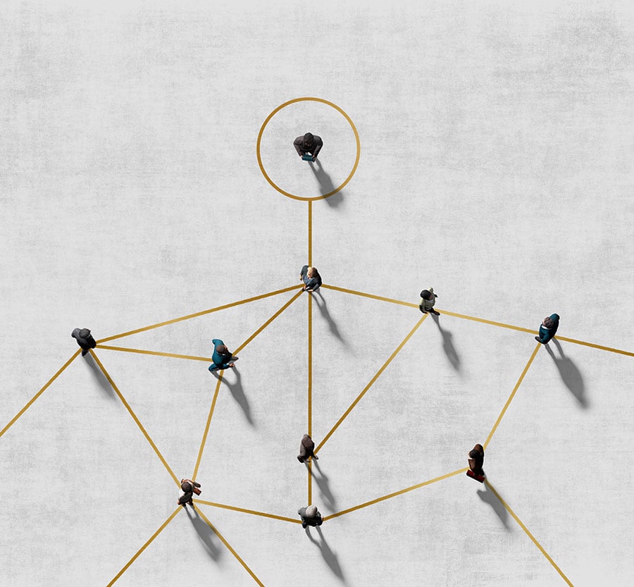 Overhead view of a gold multi-line visual with lines connecting multiple people spreading out from one singular circle and person on gray background.